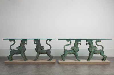 Lot A matched pair of 'griffin' console tables