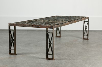 Lot 438 - A cast iron garden table
