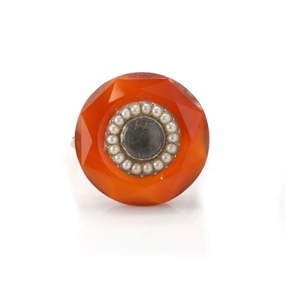 Lot 5 - An antique carved carnelian and split pearl mourning ring