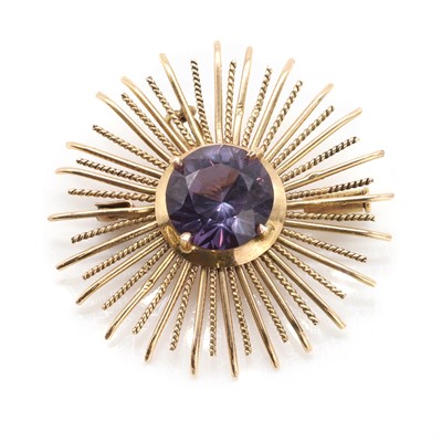 Lot 125 - A synthetic colour change sapphire sunburst brooch