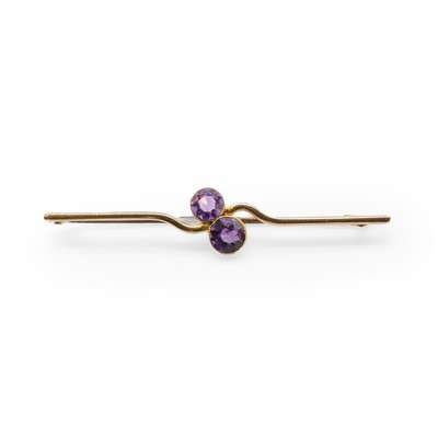 Lot 39 - An early 20th century amethyst two stone bar brooch