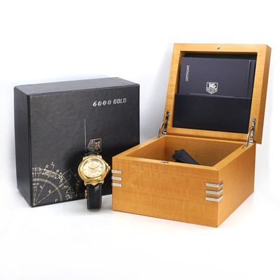 Lot 379 - An 18ct gold Tag Heuer 6000 automatic strap watch