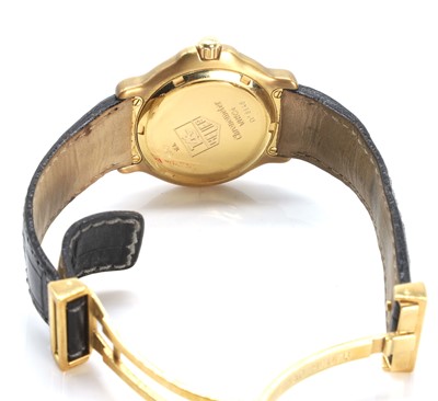 Lot 379 - An 18ct gold Tag Heuer 6000 automatic strap watch