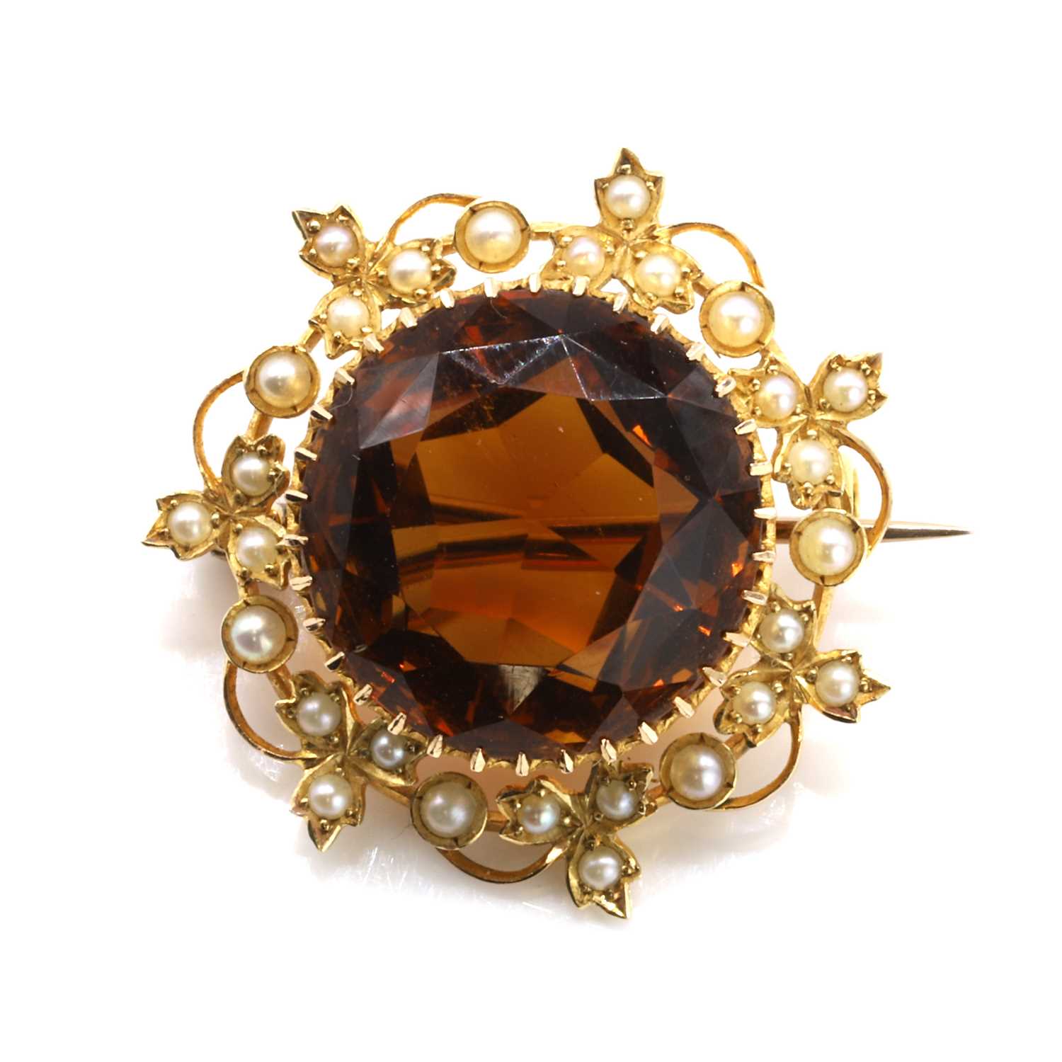 Lot 23 - An antique citrine and split pearl brooch