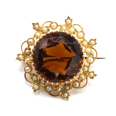Lot 23 - An antique citrine and split pearl brooch
