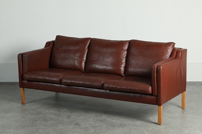 Lot 197 - A burgundy leather three-seater settee