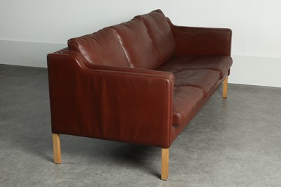 Lot 197 - A burgundy leather three-seater settee