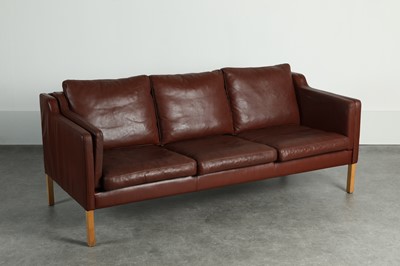 Lot 197 - A burgundy leather three-seater settee