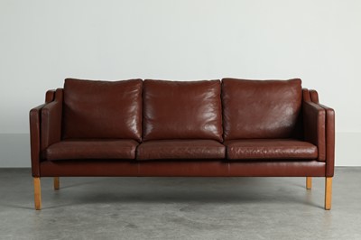 Lot 197 - A burgundy leather three-seater settee