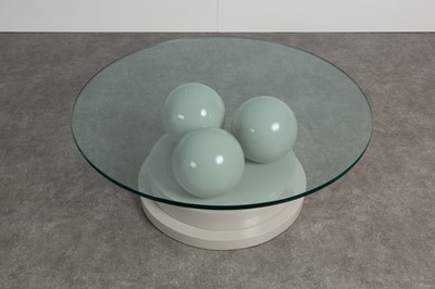 Lot 209 - A lacquered and glass coﬀee table