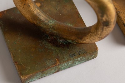 Lot 167 - A matched pair of gold-leafed cast-metal bookends