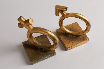Lot 167 - A matched pair of gold-leafed cast-metal bookends