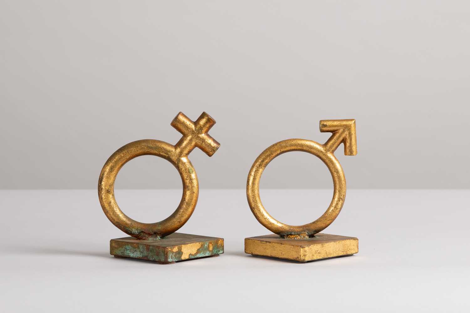 Lot 167 - A matched pair of gold-leafed cast-metal bookends