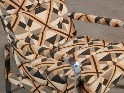 Lot 54 - A chrome-framed reclining armchair