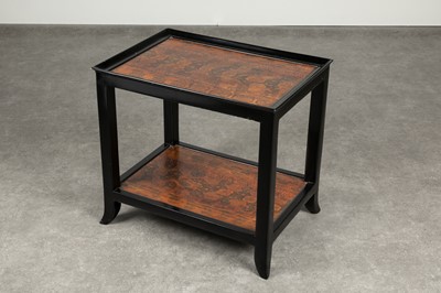 Lot 348 - A two-tiered black-lacquered occasional table