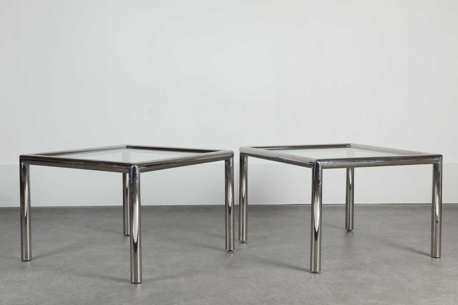 Lot 154 - A pair of chrome and glass side tables
