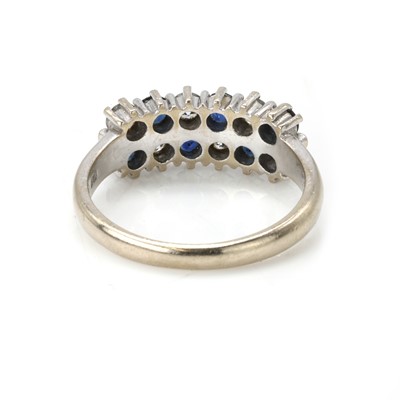 Lot 80 - An 18ct white gold sapphire and diamond cluster ring