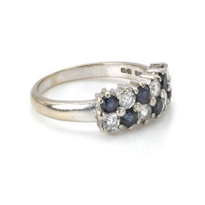 Lot 80 - An 18ct white gold sapphire and diamond cluster ring