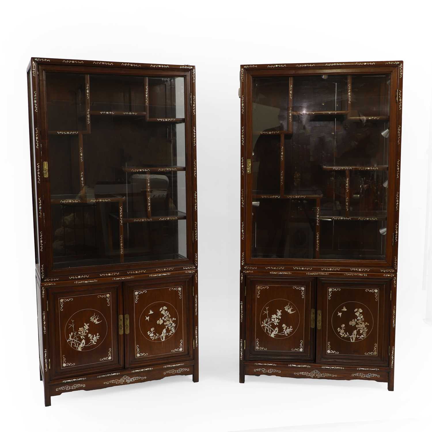 Lot 459 - A pair of Chinese inlaid rosewood and mother of pearl display cabinets