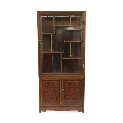 Lot 457 - A Chinese carved hardwood display cabinet