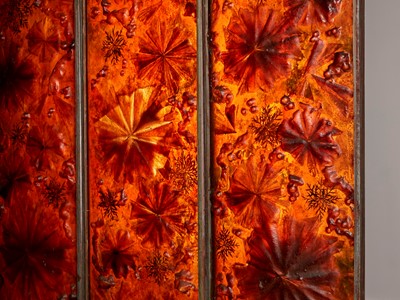 Lot 191 - A set of three resin-mounted panels