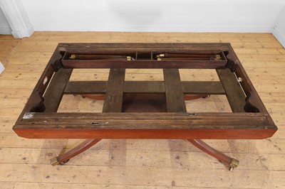 Lot 571 - A large George III figured mahogany extending dining table in the manner of Gillows
