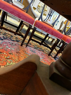 Lot 571 - A large George III figured mahogany extending dining table in the manner of Gillows