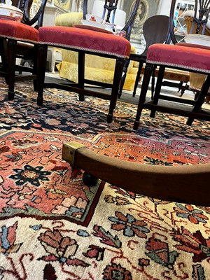 Lot 571 - A large George III figured mahogany extending dining table in the manner of Gillows