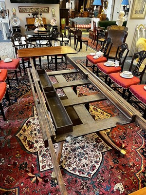 Lot 571 - A large George III figured mahogany extending dining table in the manner of Gillows