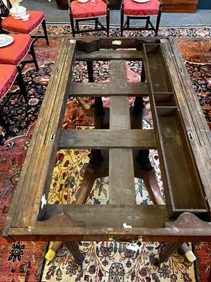 Lot 571 - A large George III figured mahogany extending dining table in the manner of Gillows