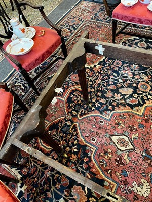 Lot 571 - A large George III figured mahogany extending dining table in the manner of Gillows