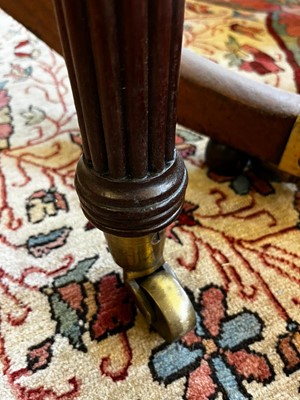 Lot 571 - A large George III figured mahogany extending dining table in the manner of Gillows