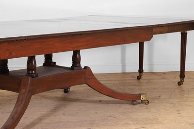 Lot 571 - A large George III figured mahogany extending dining table in the manner of Gillows