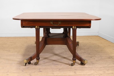 Lot 571 - A large George III figured mahogany extending dining table in the manner of Gillows