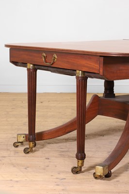Lot 571 - A large George III figured mahogany extending dining table in the manner of Gillows