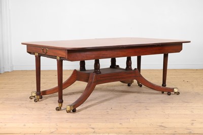 Lot 571 - A large George III figured mahogany extending dining table in the manner of Gillows