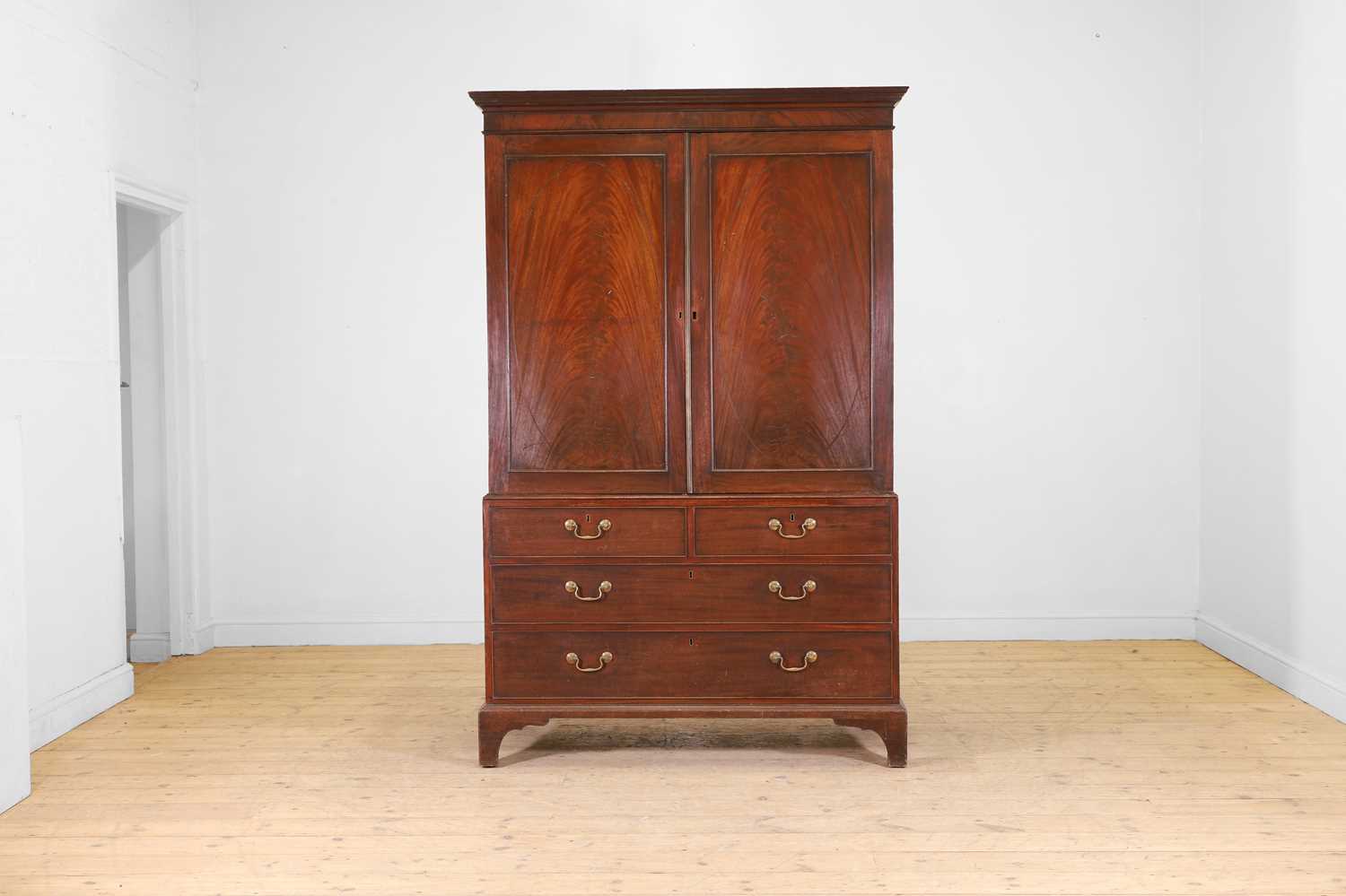 Lot 62 - A George III mahogany linen press