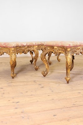 Lot 18 - A pair of carved giltwood and gesso stools or hall seats