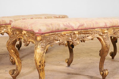 Lot 18 - A pair of carved giltwood and gesso stools or hall seats