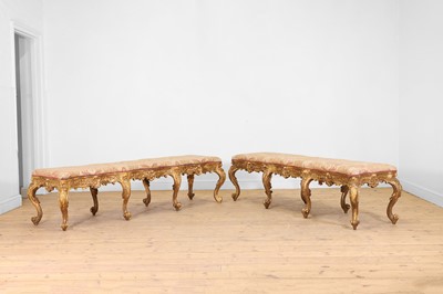 Lot 18 - A pair of carved giltwood and gesso stools or hall seats