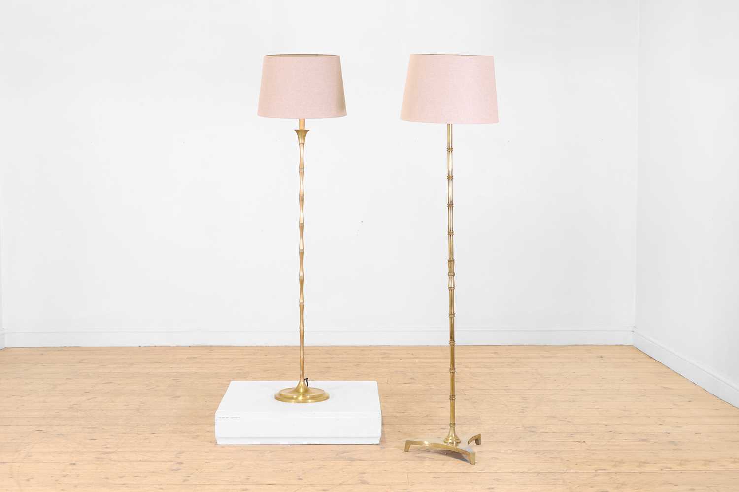 Lot 67 - Two polished brass faux bamboo floor lamps