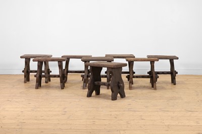 Lot 48 - A set of eight rustic oak stools