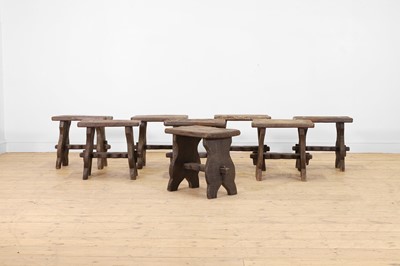 Lot 48 - A set of eight rustic oak stools