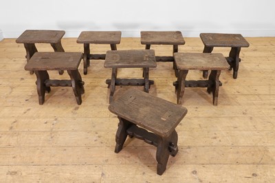 Lot 48 - A set of eight rustic oak stools