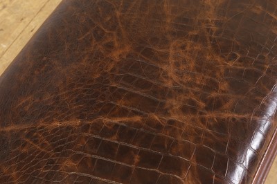 Lot 476 - A walnut and studded leather ottoman