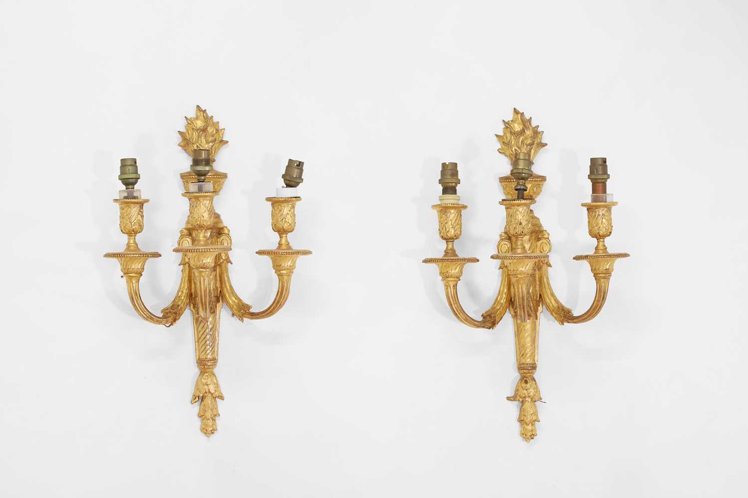 Lot 63 - A pair of Louis XVI-style carved giltwood and composition wall lights