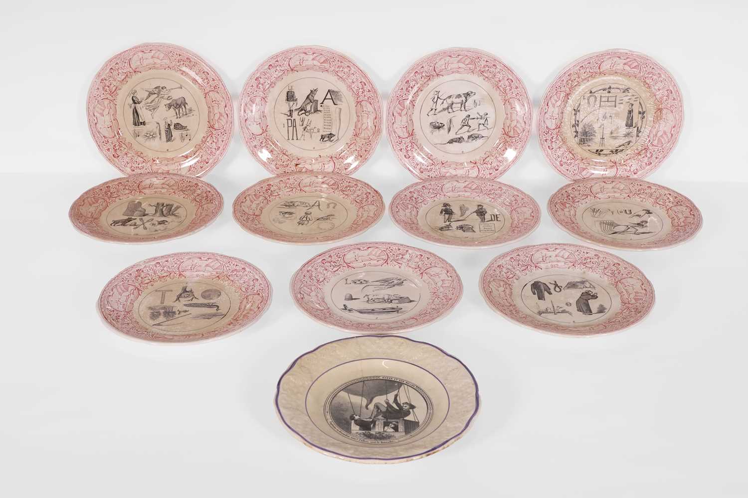 Lot 299 - A set of twelve rebus plates
