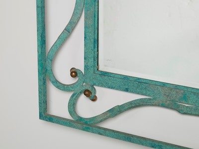 Lot 35 - An iron-verdigris-finished wall mirror