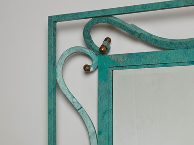 Lot 35 - An iron-verdigris-finished wall mirror