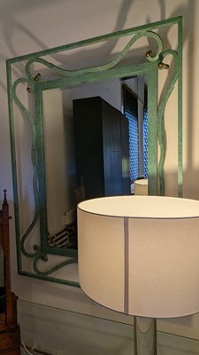 Lot 35 - An iron-verdigris-finished wall mirror